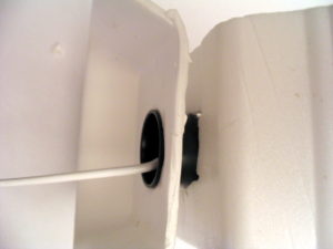 Coil winder with end plates made from a styrofoam tray. The end plates will keep the wire in one place.