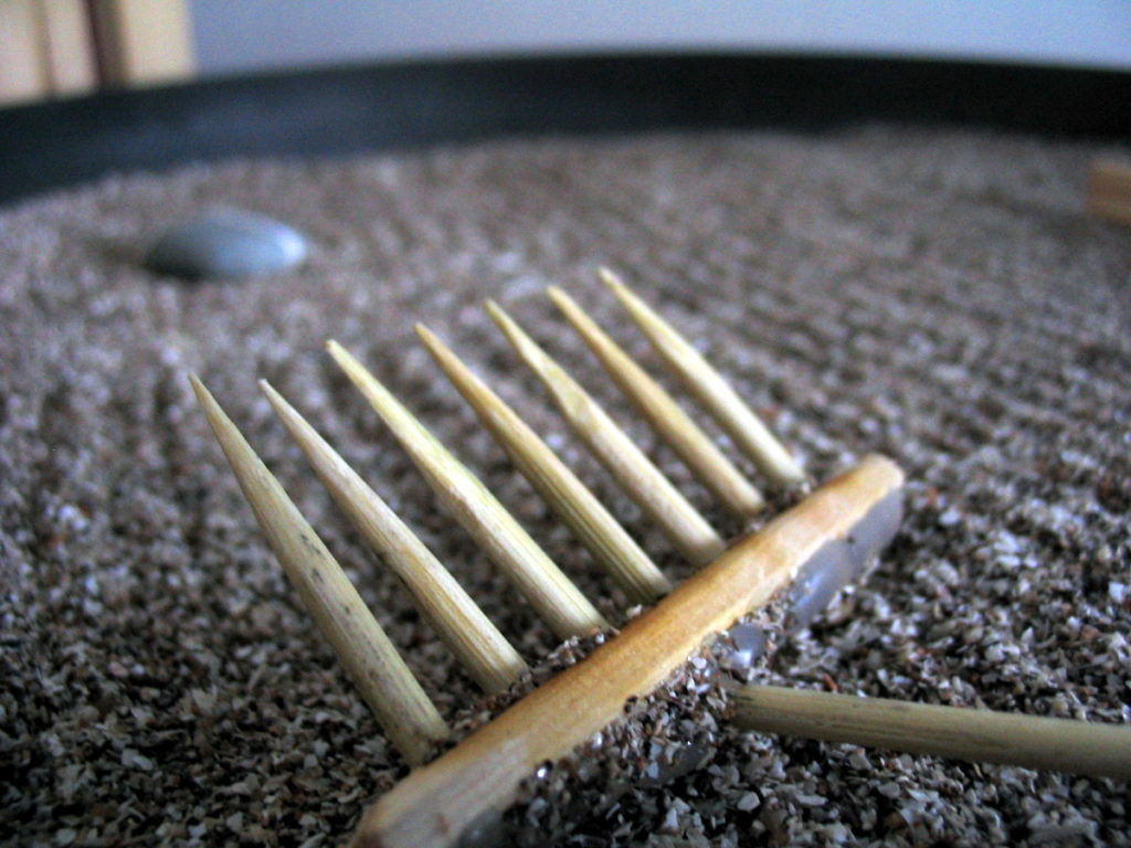 Close-up of the rake made from bamboo skewers and disposable chopsticks.