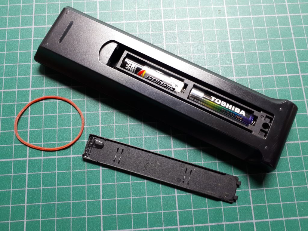 TV remote and broken battery cover