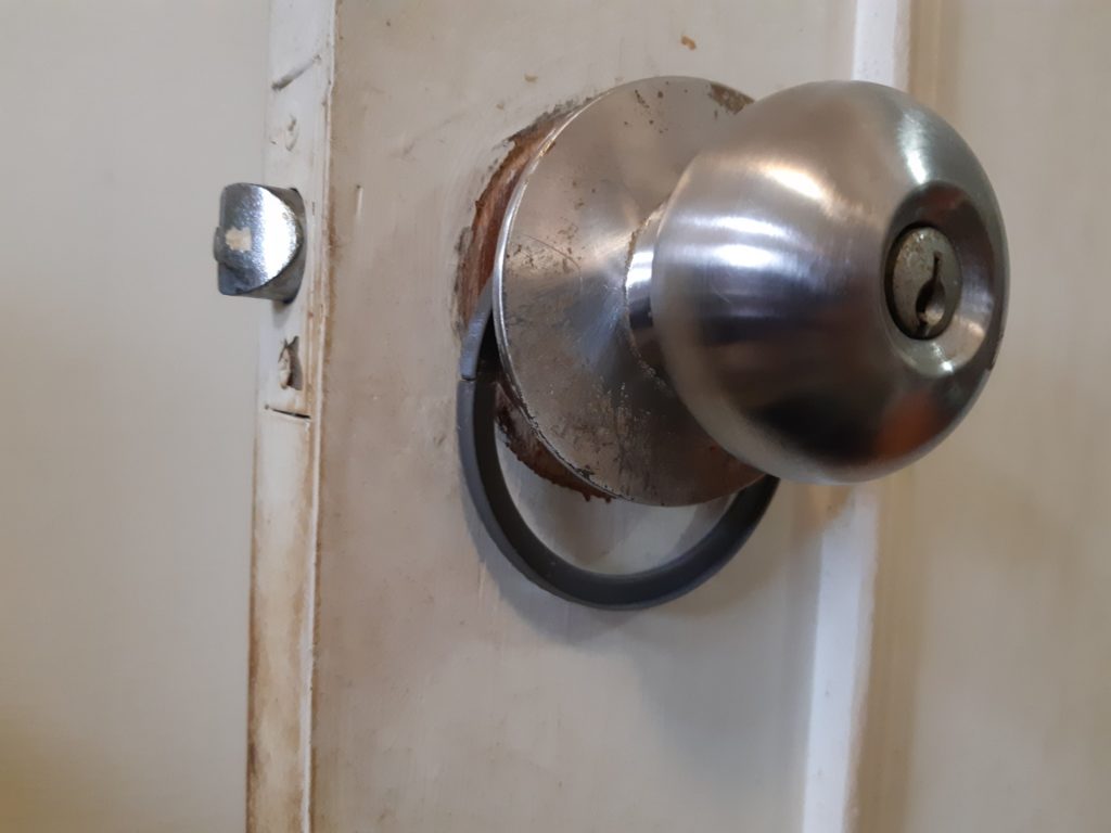 Doorknob shim assembled on doorknob